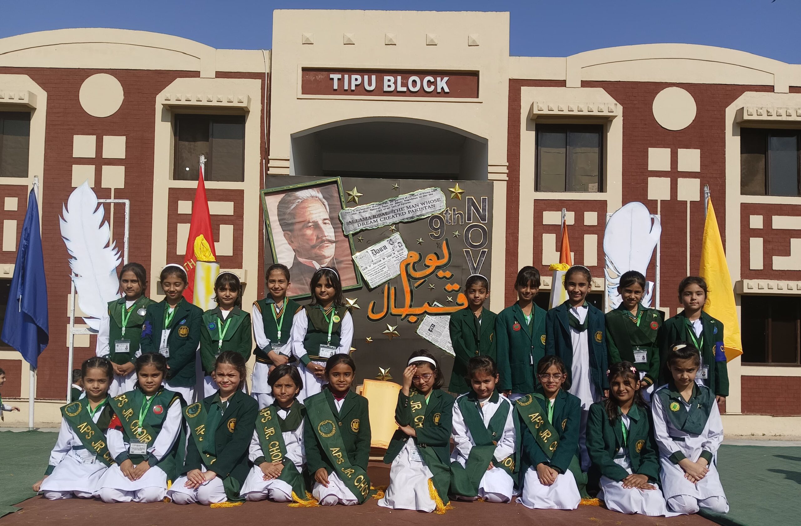Students performing on stage on Iqbal Day